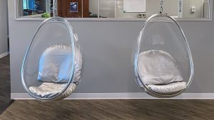 video background, two egg chairs in DEP office entrance